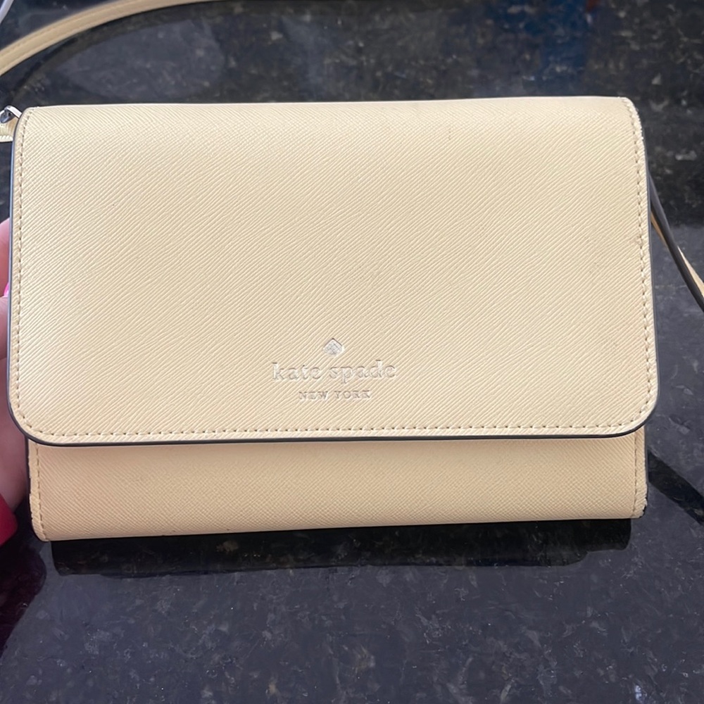 A yellow Kate spade cross body